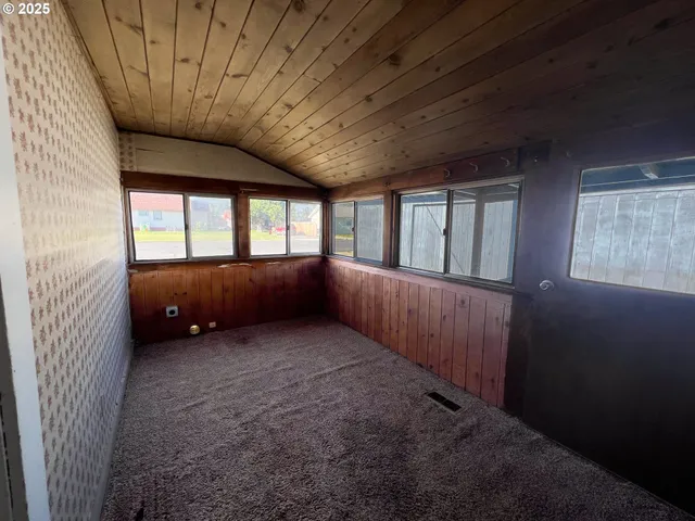 a kitchen with granite countertop a refrigerator and a stove