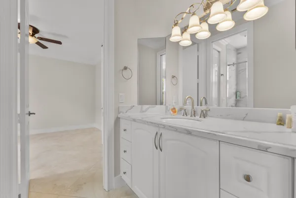 a bathroom with a double vanity sink and a mirror