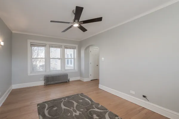 a view of livingroom with hardwood floor and ceiling fan