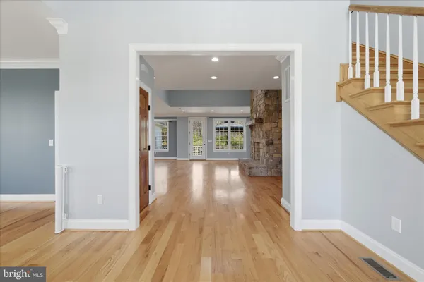 a view of a kitchen with a sink and a large window