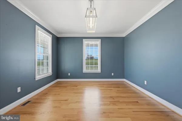 a kitchen with stainless steel appliances granite countertop a refrigerator a sink a stove a refrigerator and cabinets