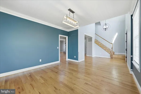 a kitchen with stainless steel appliances granite countertop a refrigerator a sink a stove and cabinets