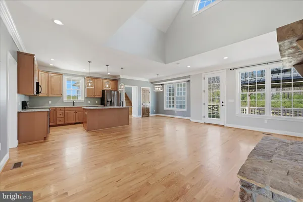 a kitchen with granite countertop a sink and window
