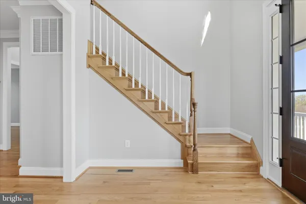 a view of empty room with wooden walls