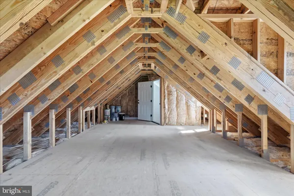 a front view of a house with a yard table and chairs