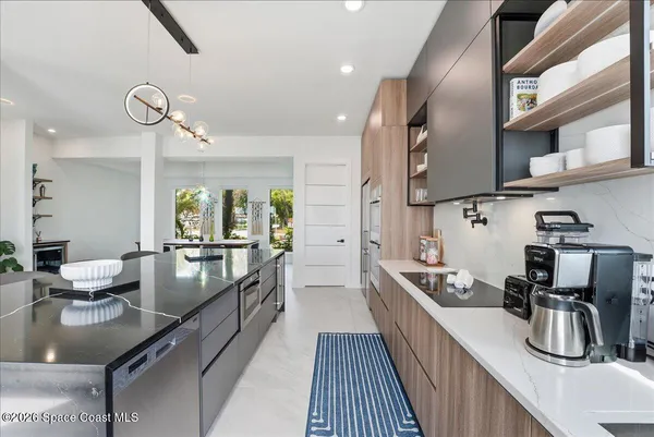 a large kitchen with stainless steel appliances lots of counter space