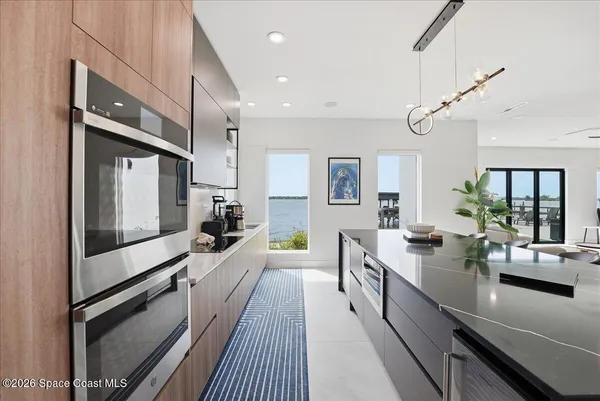 a kitchen with stainless steel appliances granite countertop a stove and a refrigerator