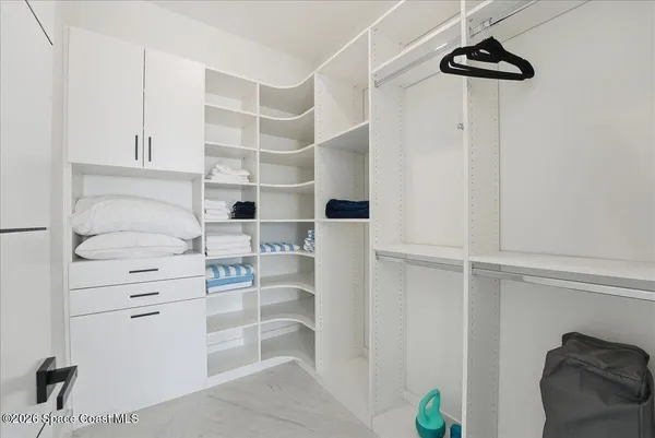 a utility room with sink dryer and washer