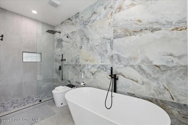 a bathroom with a sink toilet and vanity