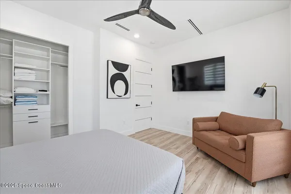 a view of a swimming pool with a yard and sitting area