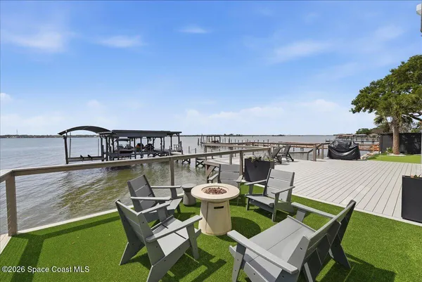 an aerial view of a houses with city view