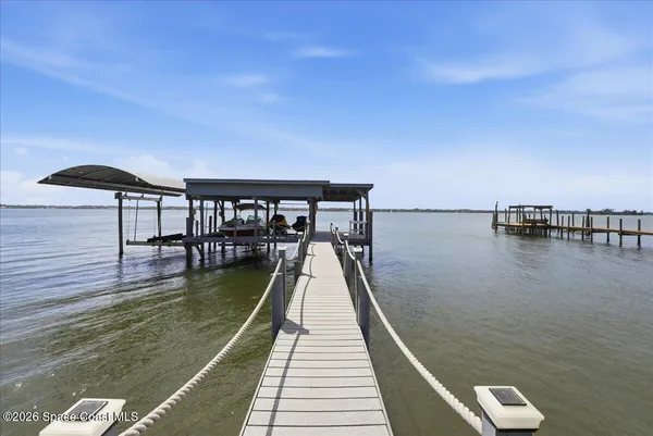 a view of swimming pool with a yard