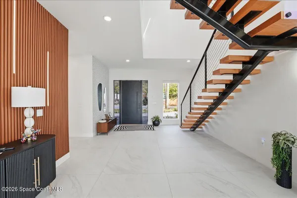 a living room with furniture or outdoor view and a large window