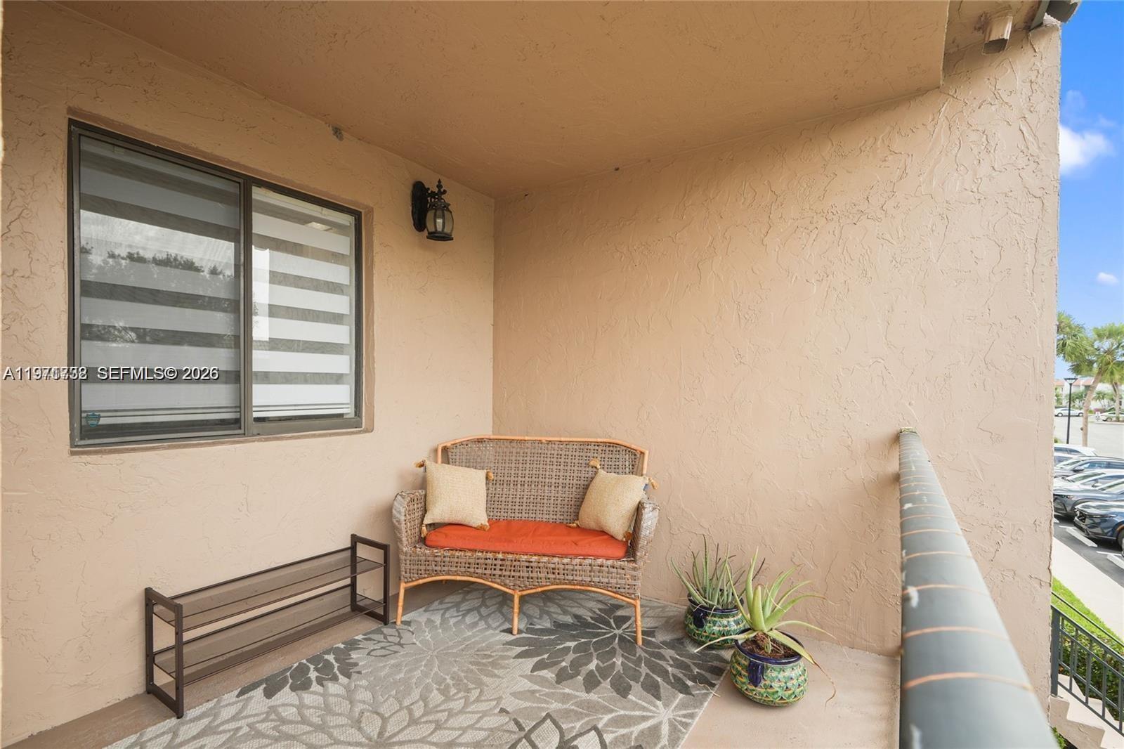 380 Racquet Club Road, Unit 204 Weston, FL 33326 - Photo 15 of 15 a chair and a table in a room
