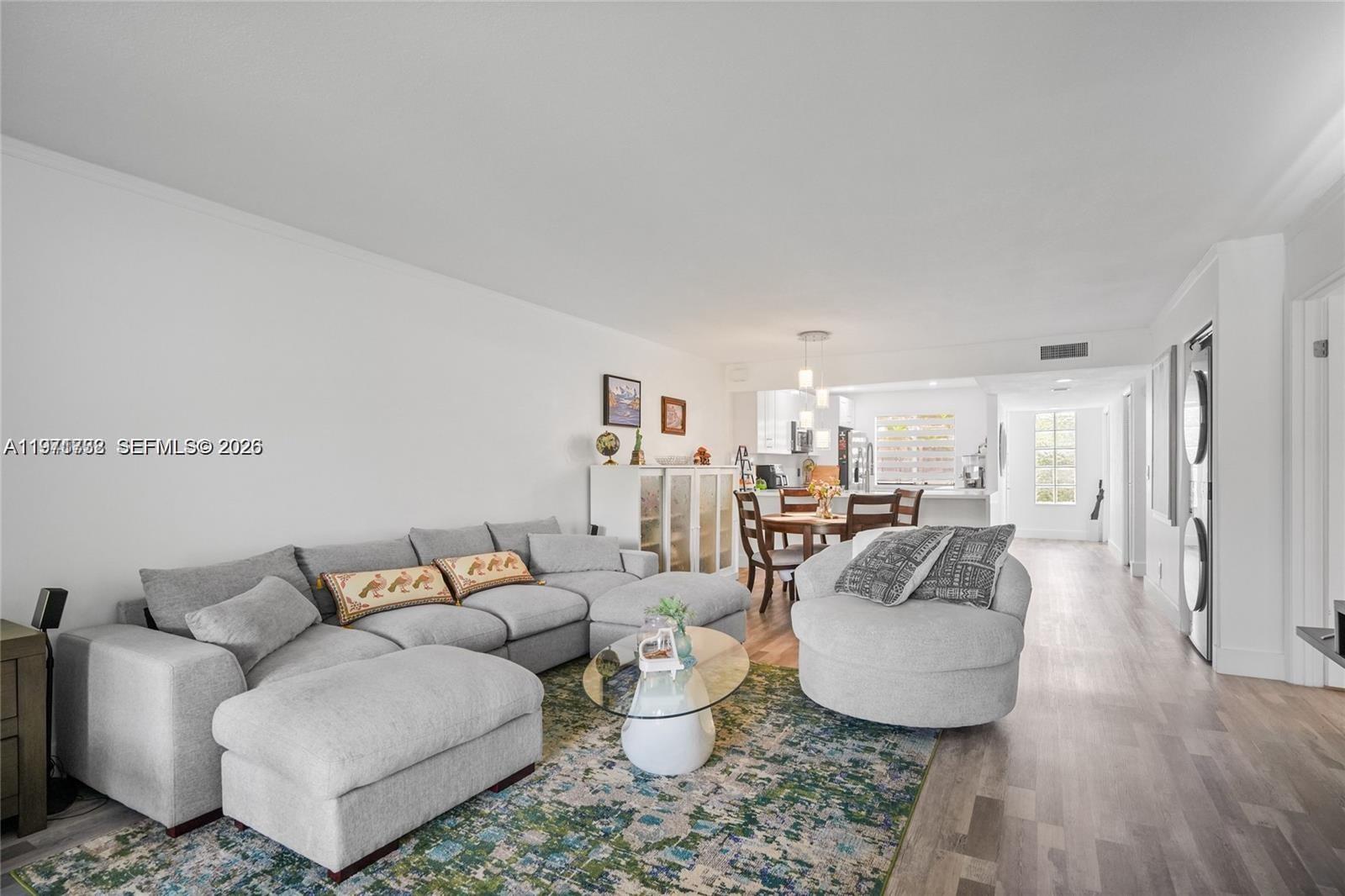 380 Racquet Club Road, Unit 204 Weston, FL 33326 - Photo 8 of 15 a living room with furniture and a large window