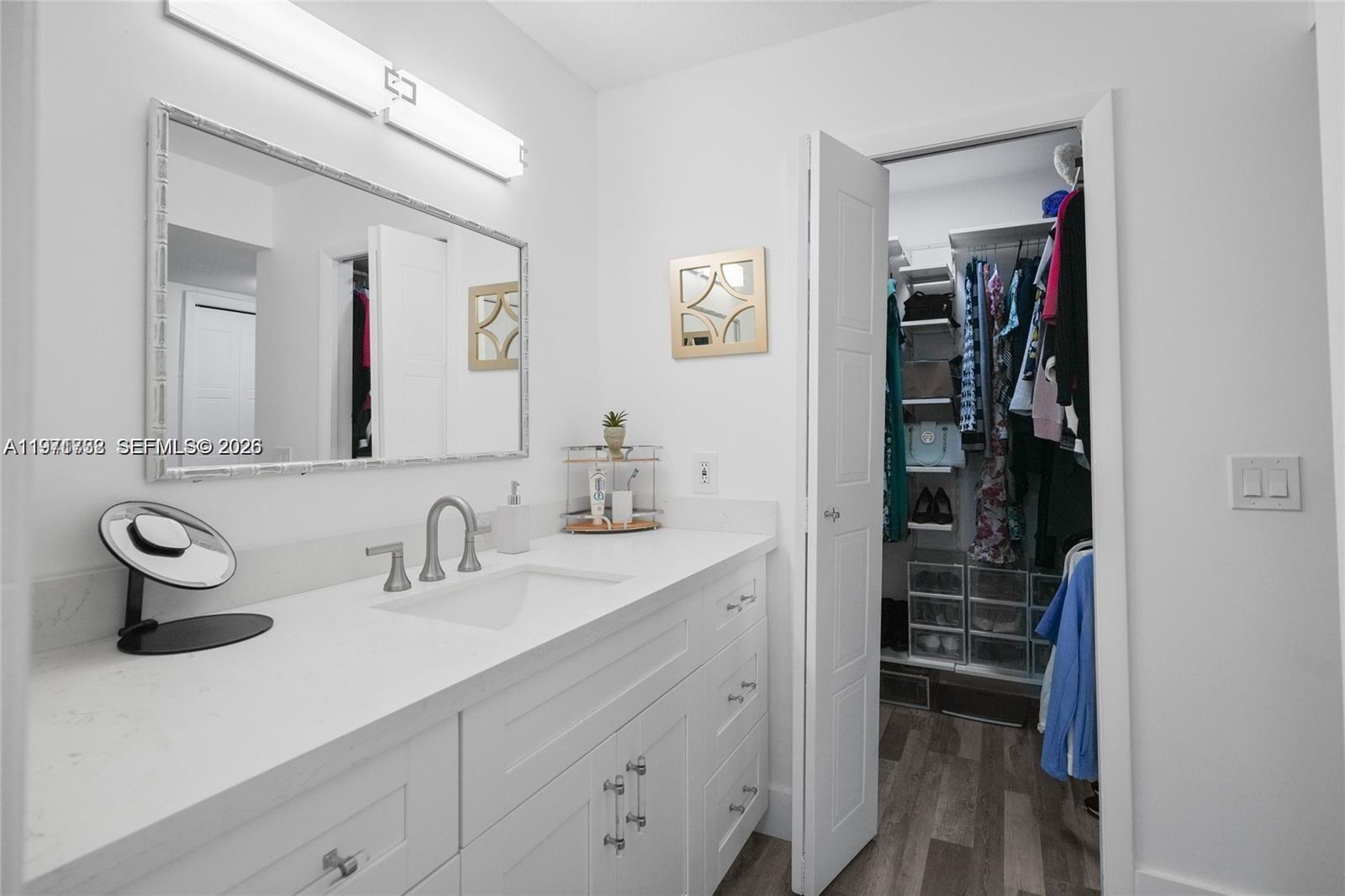 380 Racquet Club Road, Unit 204 Weston, FL 33326 - Photo 10 of 15 a bathroom with a sink and a mirror