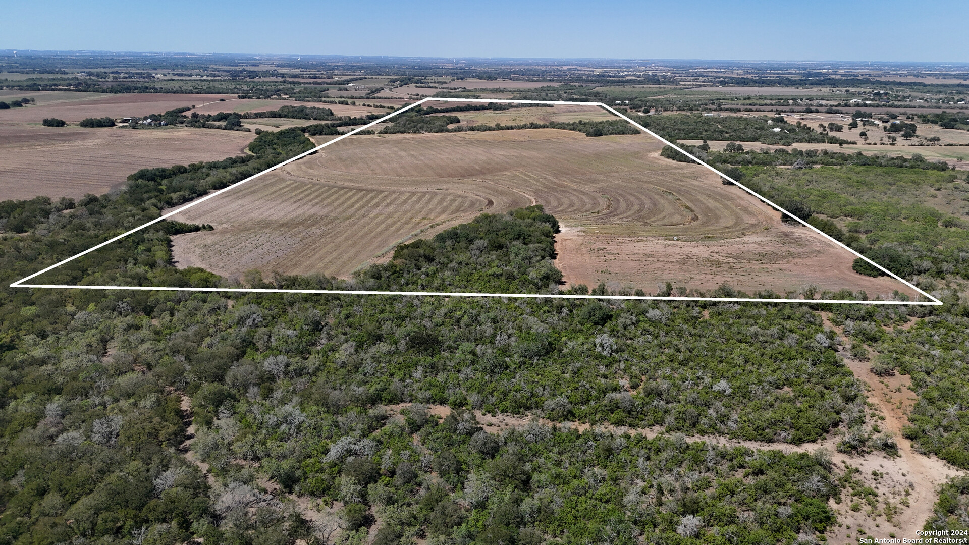 16568 New Berlin Road St. Hedwig, TX 78152 - Photo 4 of 10 an aerial view of residential houses with outdoor space