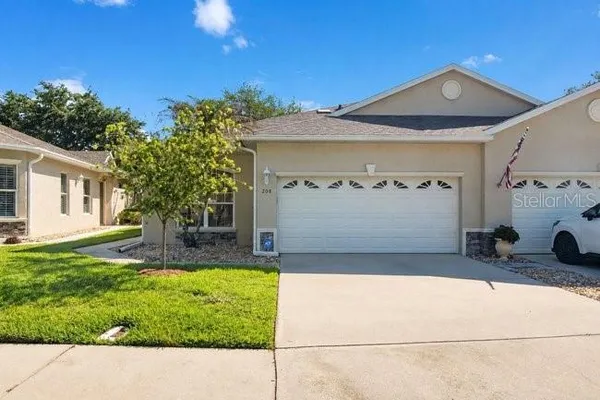a view of a front of a house with a yard