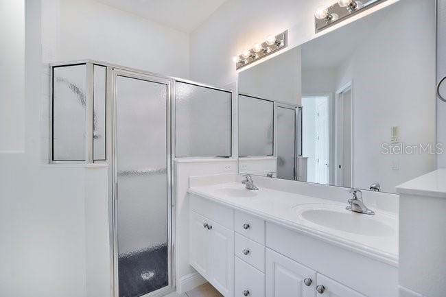 208 Lamonte Pointe Circle DeBary, FL 32713 - Photo 21 of 47 a bathroom with a double vanity sink mirror and double