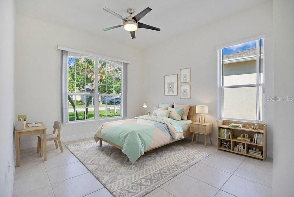 208 Lamonte Pointe Circle DeBary, FL 32713 - Photo 23 of 47 a living room with a bed furniture and a window