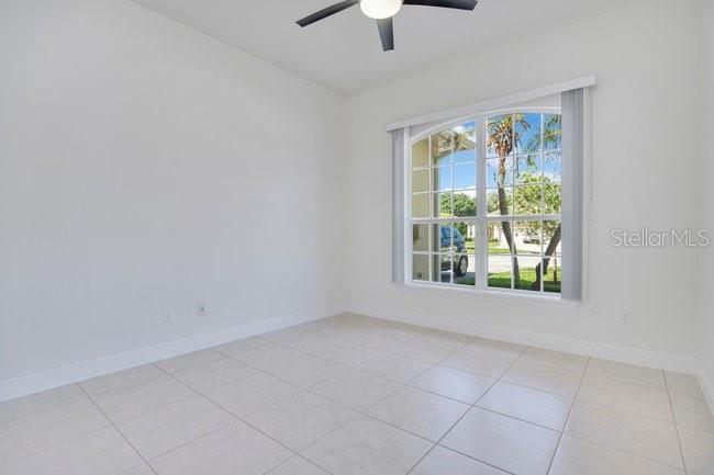 208 Lamonte Pointe Circle DeBary, FL 32713 - Photo 25 of 47 an empty room with windows and chandelier fan