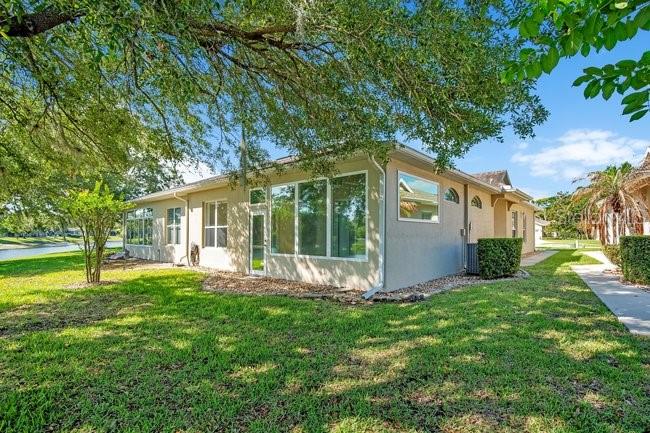 208 Lamonte Pointe Circle DeBary, FL 32713 - Photo 30 of 47 a view of a house with backyard and a tree