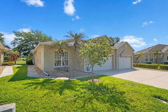 208 Lamonte Pointe Circle DeBary, FL 32713 - Photo 3 of 47 front view of a house with a yard