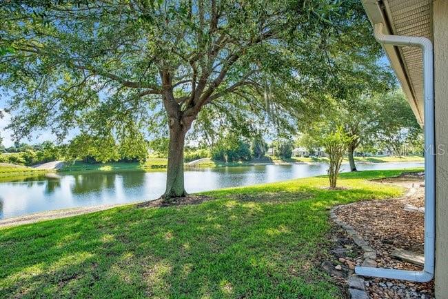 208 Lamonte Pointe Circle DeBary, FL 32713 - Photo 32 of 47 a view of a lake with a house
