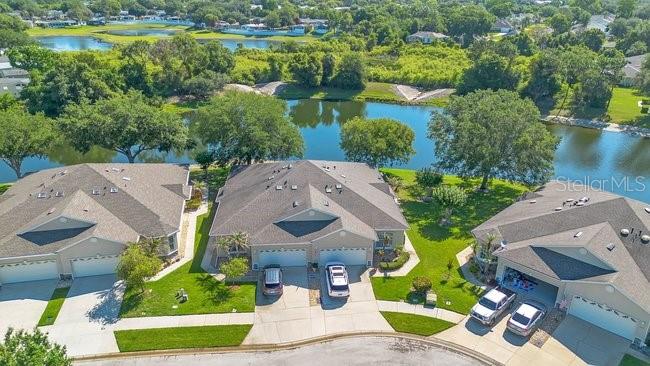208 Lamonte Pointe Circle DeBary, FL 32713 - Photo 37 of 47 an aerial view of a house with a garden and lake view