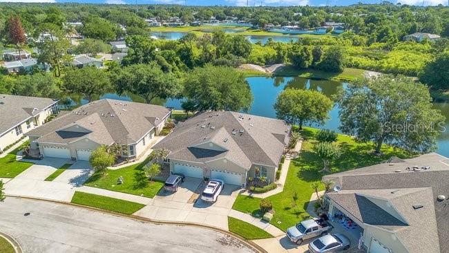 208 Lamonte Pointe Circle DeBary, FL 32713 - Photo 38 of 47 an aerial view of a house with a garden and lake view