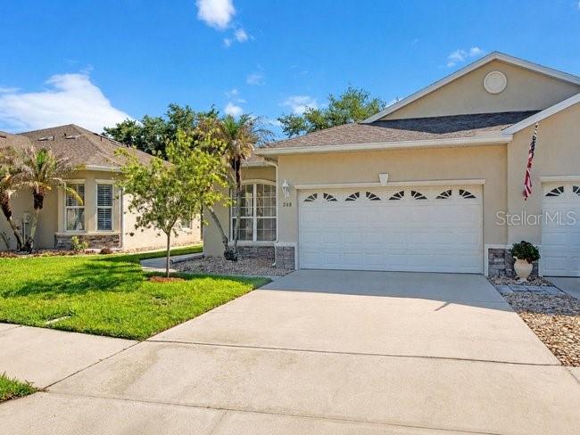 208 Lamonte Pointe Circle DeBary, FL 32713 - Photo 43 of 47 a front view of a house with a yard and garage