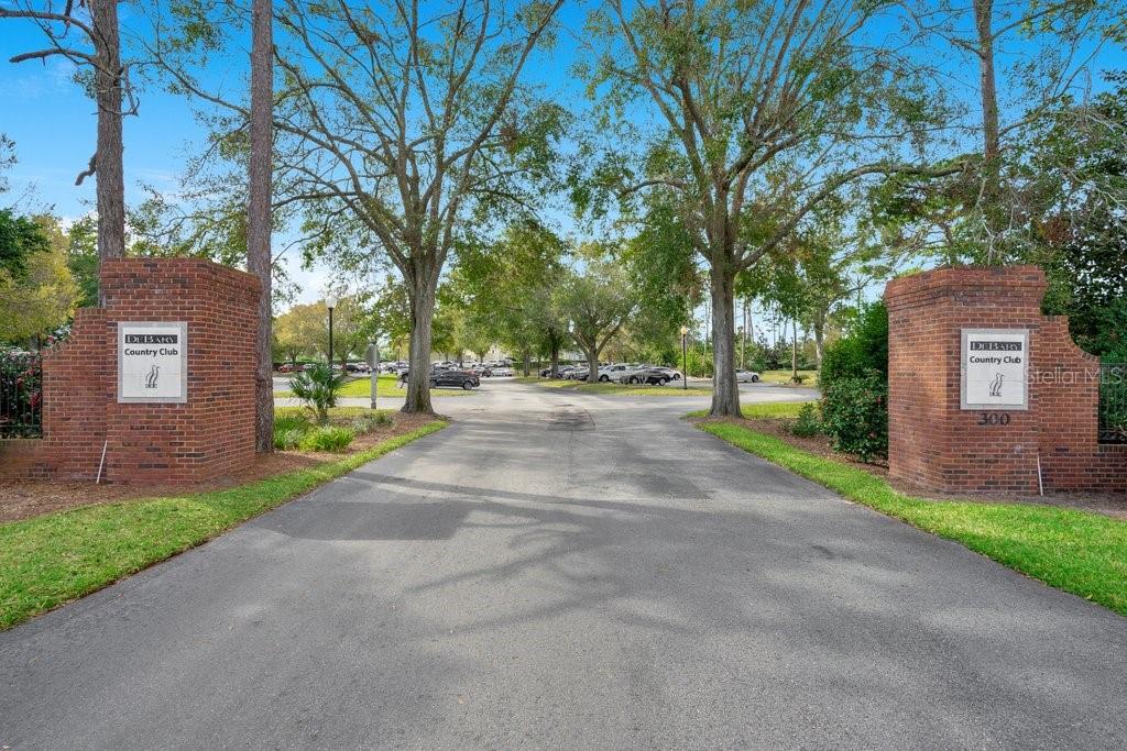 208 Lamonte Pointe Circle DeBary, FL 32713 - Photo 44 of 47 a view of a brick house with a big yard and large trees