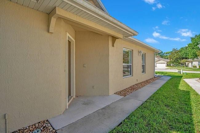 208 Lamonte Pointe Circle DeBary, FL 32713 - Photo 5 of 47 a view of a back yard of the house