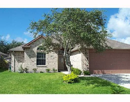 a backyard of a house with lots of green space
