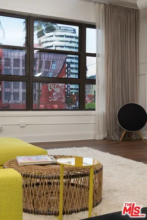 a living room with a rug and a table