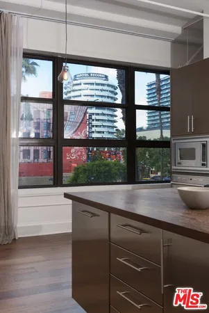 a kitchen with a sink and large window
