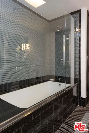 a bathroom with a sink and a shower