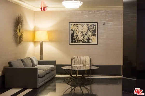 a living room with furniture and a table