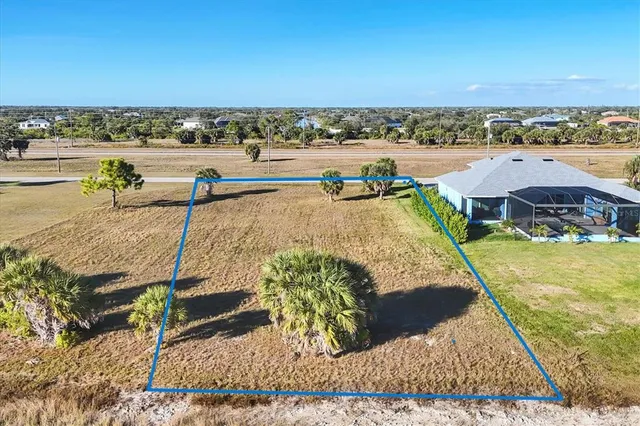 a view of a swimming pool and an outdoor seating