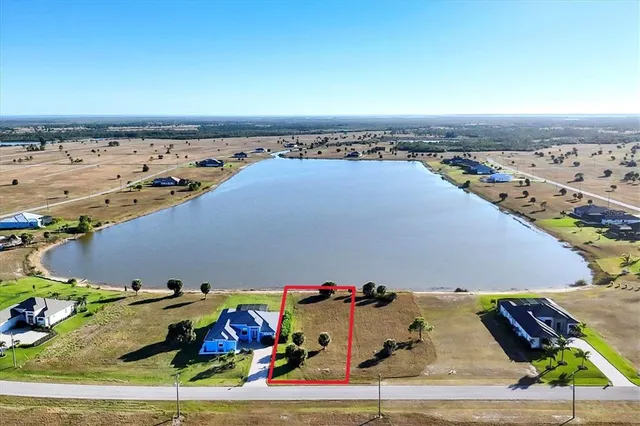 an aerial view of a house with a ocean view
