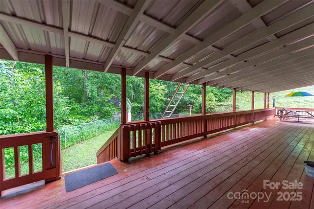 a view of porch with wooden floor
