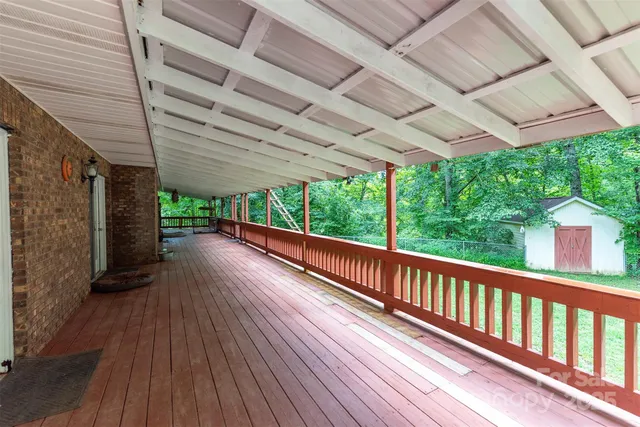 a view of a balcony with wooden floor