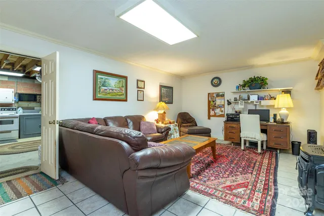 a living room with furniture window and wooden floor
