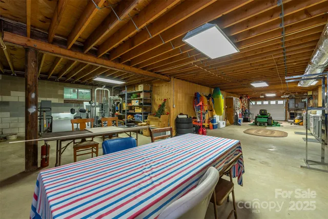 a view of a patio with table and chairs under an umbrella
