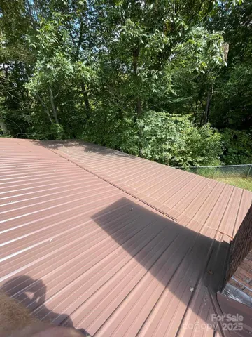 a view of a tiny house with a backyard