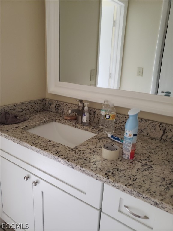 7491 Love Road Fort Myers, FL 33967 - Photo 4 of 5 a bathroom with a sink and a mirror