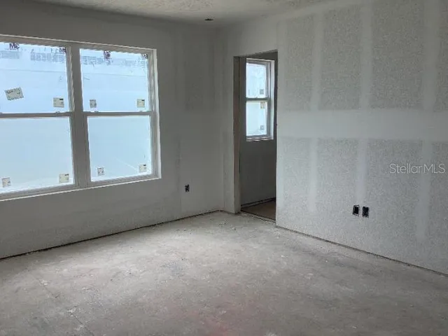 an empty room with windows