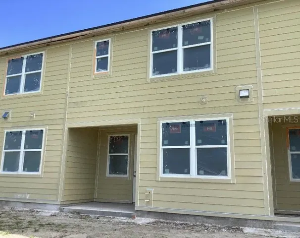 a view of a back yard of the house