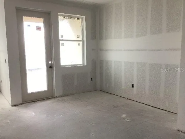 a view of an empty room with a window