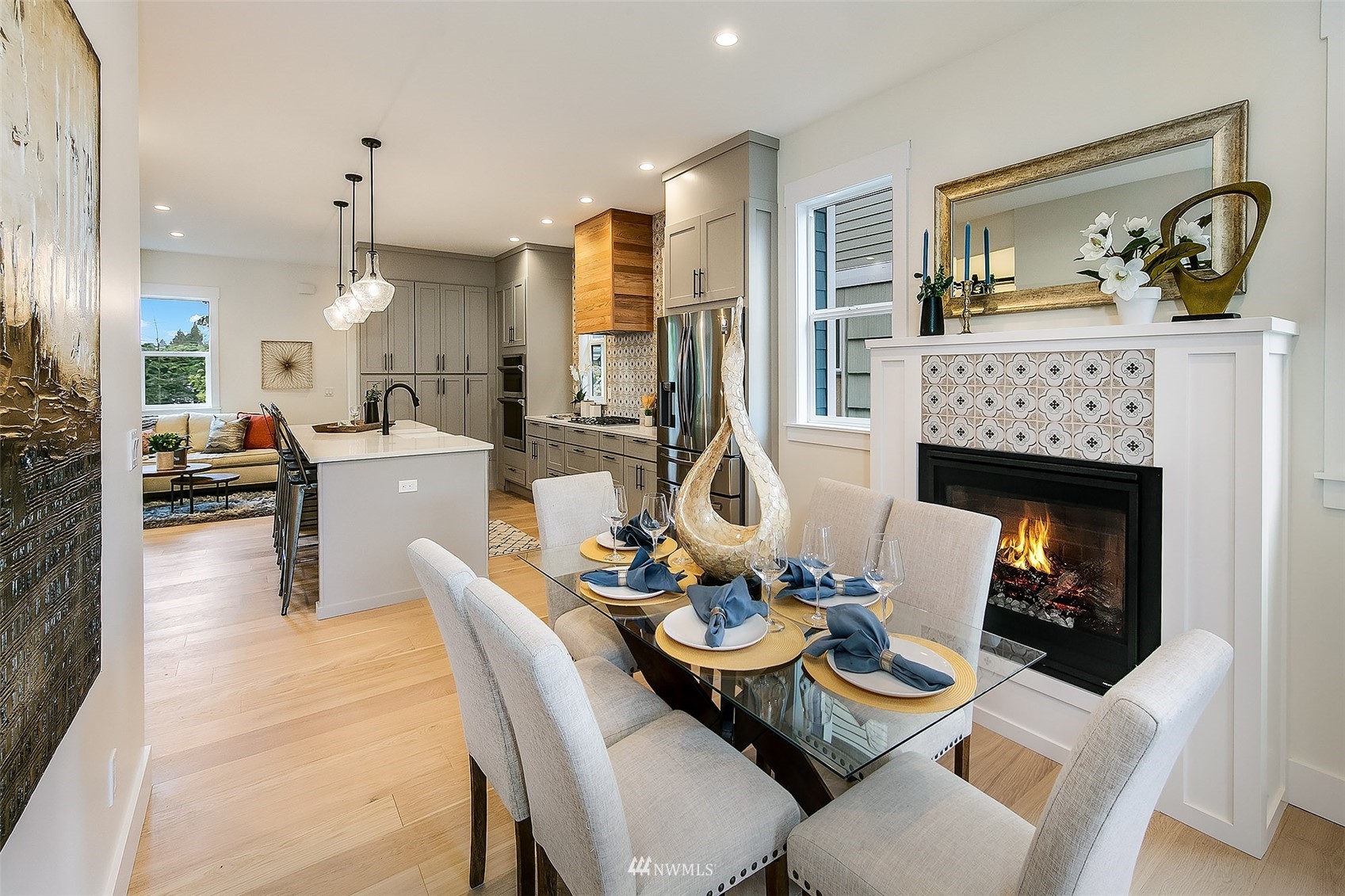 2143 6th Avenue West Seattle, WA 98119 - Photo 12 of 31 a dining room with furniture a fireplace and dining table